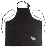 Black kitchen apron with front pocket and grilling utensils logo on lower right corner