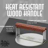 Stainless steel burger press with heat-resistant wood handle, comfortable wide grip, kitchenware product.
