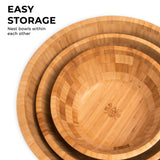 Set of three nested bamboo wooden salad bowls, stackable for easy storage.