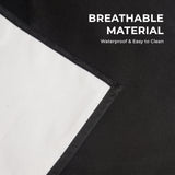 Close-up of black apron fabric with a light backing; graphic claims breathable material, waterproof and easy to clean.