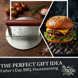 Stainless steel burger press with leather handle, grilled cheeseburger, herbs, coarse salt on wood, gift idea for BBQ and Father's Day.
