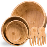 Three-piece bamboo wooden salad bowl set with salad servers on white background